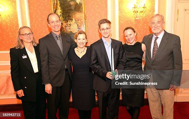 Edward Snowden receives the Sam Adams Associates for Integrity in Intelligence Award alongside UK WikiLeaks journalist Sarah Harrison who took...