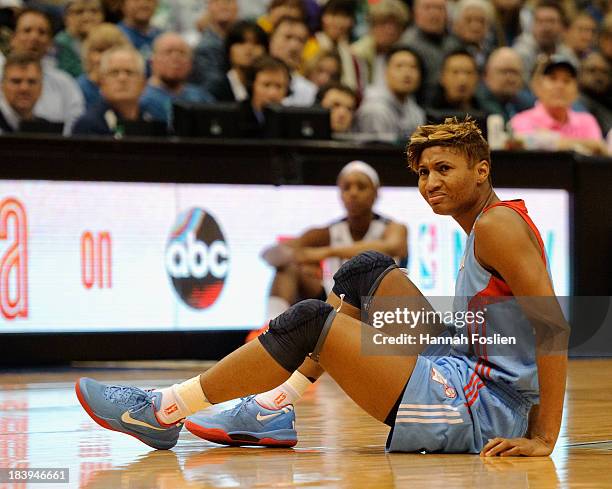 Angel McCoughtry of the Atlanta Dream looks on after falling to the court during Game One of the 2013 WNBA Finals against the Minnesota Lynx on...