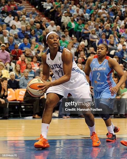 Monica Wright of the Minnesota Lynx looks to pass the ball during Game One of the 2013 WNBA Finals against the Atlanta Dream on October 6, 2013 at...