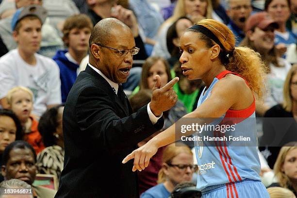 Jasmine Thomas of the Atlanta Dream speaks with head coach Fred Williams during Game One of the 2013 WNBA Finals against the Minnesota Lynx on...