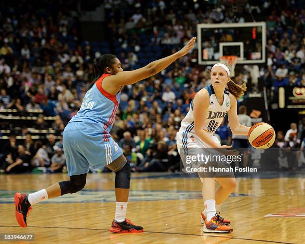 Alex Bentley of the Atlanta Dream defends against Lindsey Moore of the Minnesota Lynx during Game One of the 2013 WNBA Finals on October 6, 2013 at...