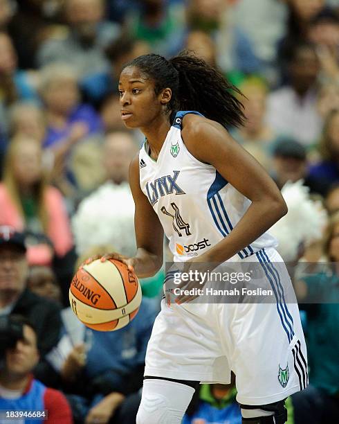 Devereaux Peters of the Minnesota Lynx dribbles the ball during Game One of the 2013 WNBA Finals against the Atlanta Dream on October 6, 2013 at...