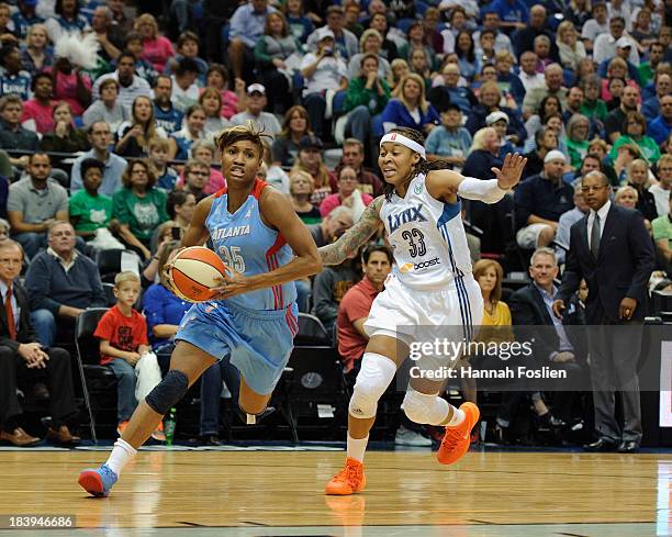 Angel McCoughtry of the Atlanta Dream drives to the basket against Seimone Augustus of the Minnesota Lynx during Game Two of the 2013 WNBA Finals on...