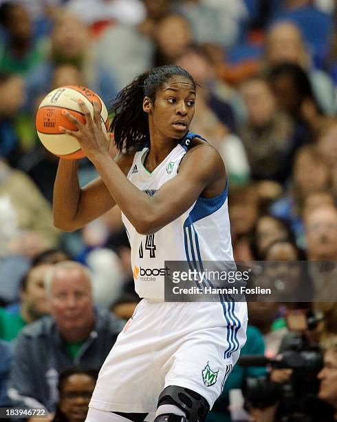 Devereaux Peters of the Minnesota Lynx looks to pass the ball during Game One of the 2013 WNBA Finals against the Atlanta Dream on October 6, 2013 at...