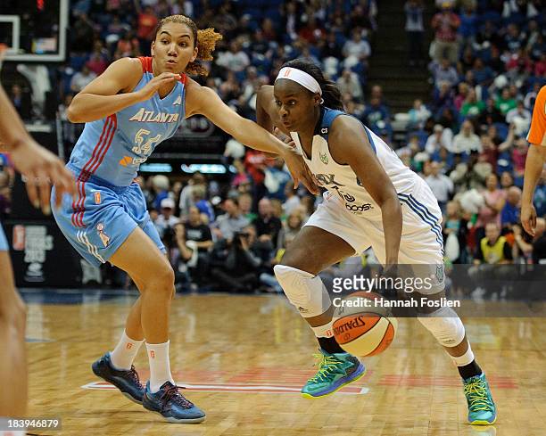 Sugar Rodgers of the Minnesota Lynx drives to the basket against Courtney Clements of the Atlanta Dream during Game Two of the 2013 WNBA Finals on...
