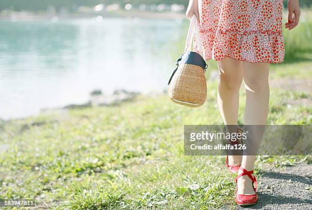 walking along the lake side on a sunny day - flats footwear stock pictures, royalty-free photos & images