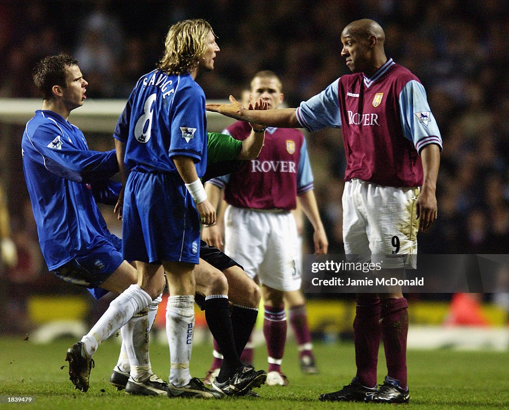 Robbie Savage of Birmingham City argues with Dion Dublin of Aston Villa