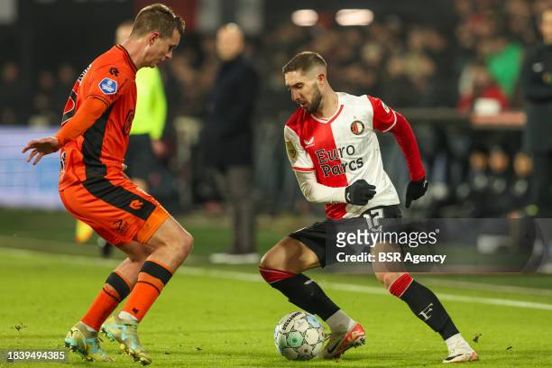 Luka Ivanusec of Feyenoord is challenged by Josh Flint of FC Volendam during the Dutch Eredivisie match between Feyenoord and FC Volendam at Stadion...