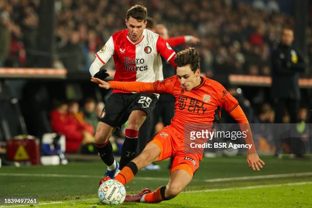 Santiago Gimenez of Feyenoord is challenged by Josh Flint of FC Volendam during the Dutch Eredivisie match between Feyenoord and FC Volendam at...