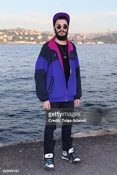 Murat Kaynum wears a Zara shirt, Topman pants, Nike shoes, vintage Puma jacket and a Boy London cap during Mercedes-Benz Fashion Week Istanbul s/s...