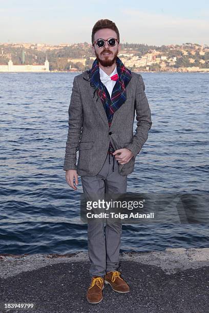 Goze Sener wears Zara pants, H&M jacket and Vakko shirt during Mercedes-Benz Fashion Week Istanbul s/s 2014 presented by American Express on October...