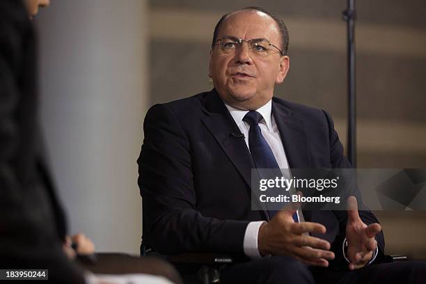 Axel Weber, chairman of UBS AG, speaks during a Bloomberg Television interview at the International Monetary Fund and World Bank Group Annual...