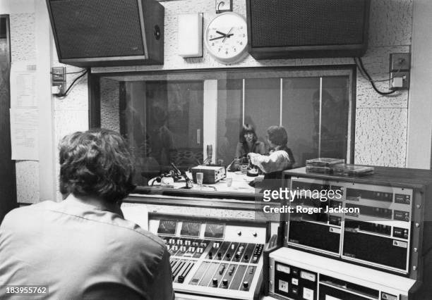 Technician watches from a booth as journalists Janet Street-Porter and Paul Callan present their mid-morning show, 'Two In The Morning', on the first...