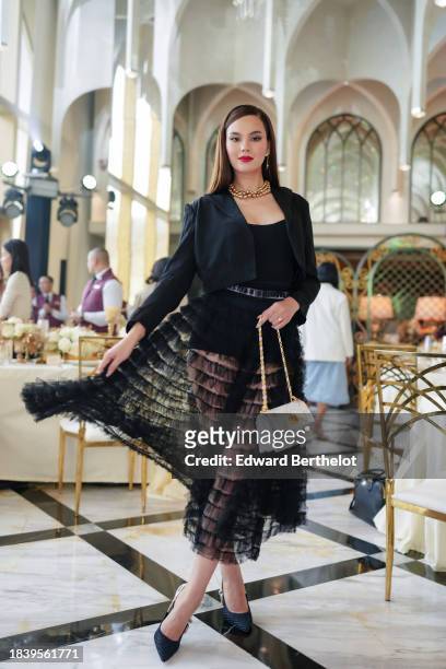 Catriona Gray, Miss Universe 2018 and Miss Universe Philippines 2018, is seen wearing a Dior full look, a golden necklace, a black cropped blazer...
