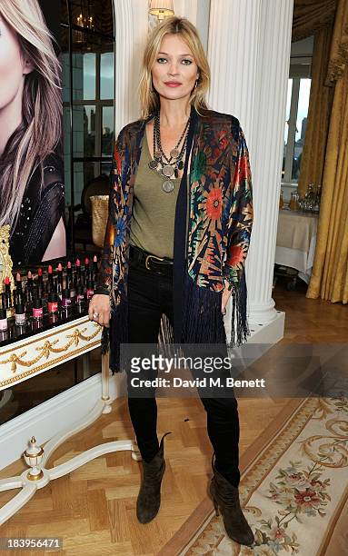 Kate Moss attends the Rimmel London 180 Years Of Cool photocall at The Savoy Hotel on October 10, 2013 in London, England.