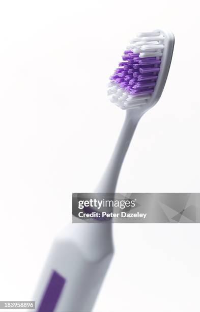 electric tooth brush with copy space - toothbrush stock pictures, royalty-free photos & images