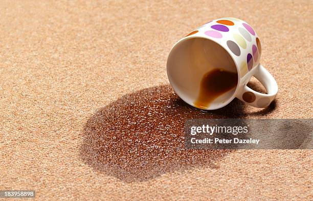 spilled coffee/tee on carpet - tapijt stockfoto's en -beelden