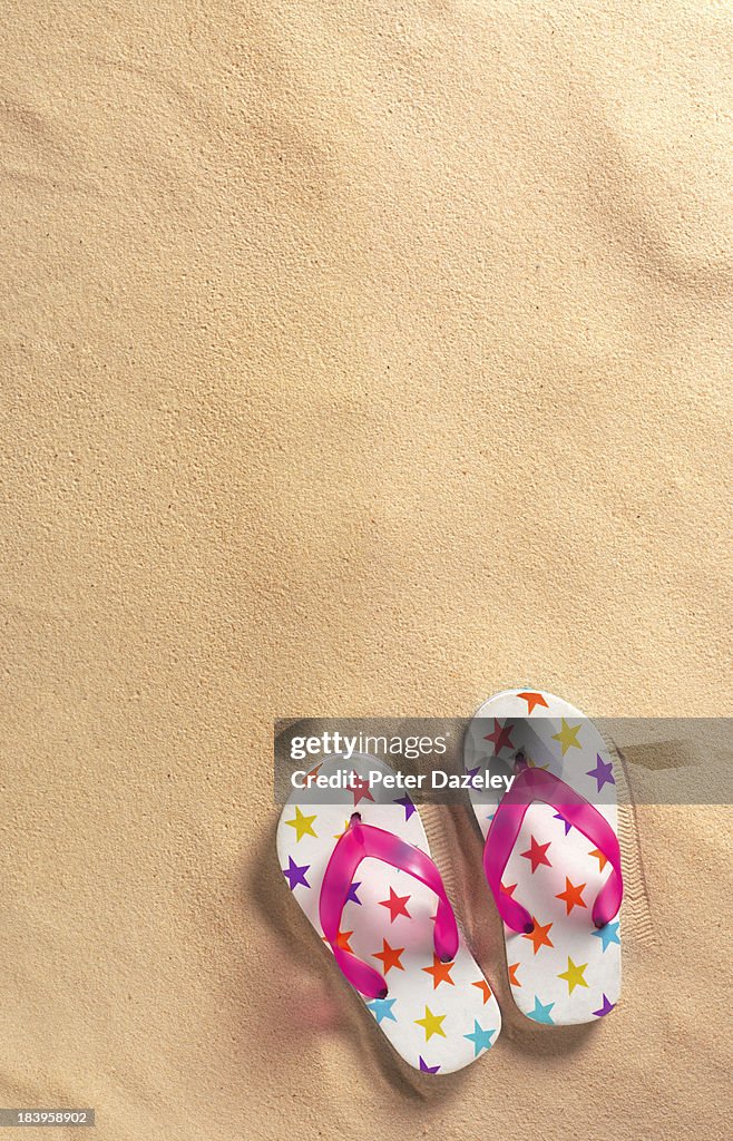 Flip-flops on beach with copy space