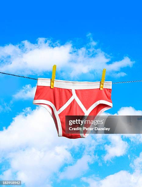 red y-fronts on washing line - washing line stock pictures, royalty-free photos & images