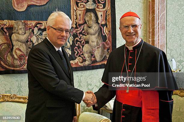 Croatia's President Ivo Josipovic meets Cardinal Secretary of State Tarcisio Bertone after an audience with Pope Francis on October 10, 2013 in...