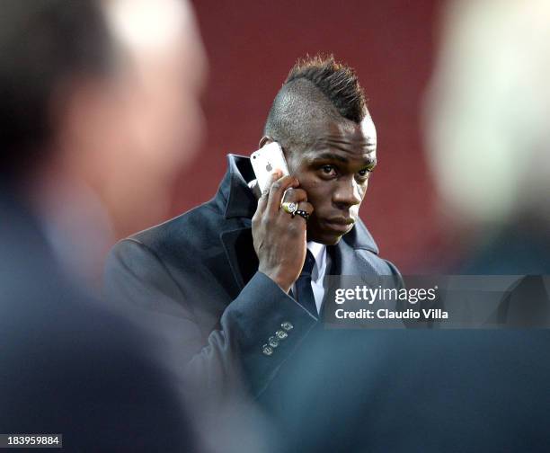 Mario Balotelli of Italy inspects the pitch ahead of tomorrow's FIFA 2014 World Cup group B Qualifier against Denmark at Parken Stadium on October...