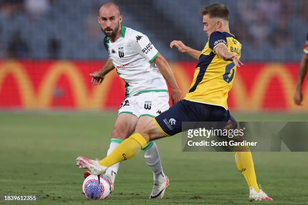 Max Balard of the Mariners defends the ball following a Angus Thurgate of Western United kick during the A-League Men round seven match between...