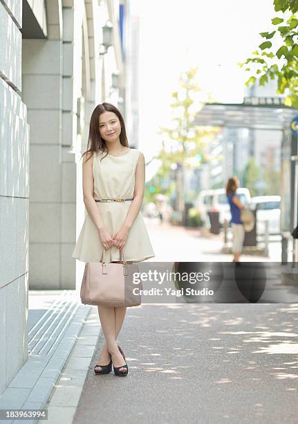 woman standing in the city of kyoto - 若い女性一人 ストックフォトと画像