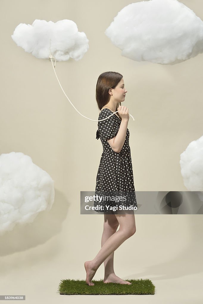 Women connecting by a rope cloud