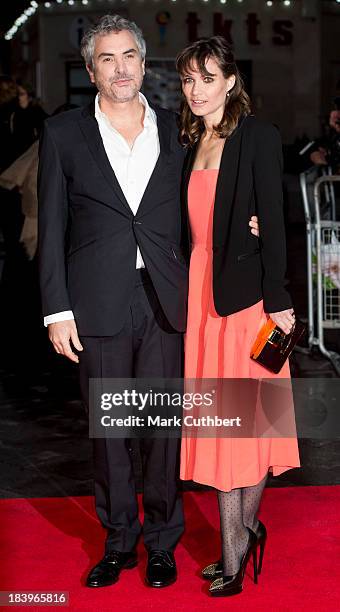 Alfonso Cuaron and Sheherazade Goldsmith attend a screening of "Gravity" during the 57th BFI London Film Festival at Odeon Leicester Square on...