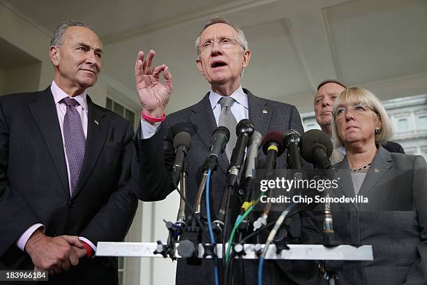 Senate Majority Leader Harry Reid talks to reporters with Sen. Charles Schumer , Senate Majority Whip Richard Durbin and Sen. Patty Murray after...