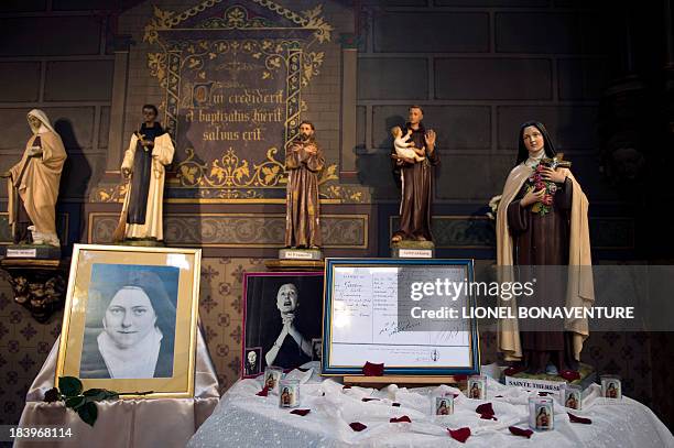 The baptismal certificate of French singer Edith Piaf is displayed during a ceremony to commemorate 50 years since her death on October 10, 2013 at...