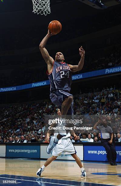 Richard Jefferson of the New Jersey Nets drives to the basket during the NBA game against the Washington Wizards at MCI Center on February 21, 2003...