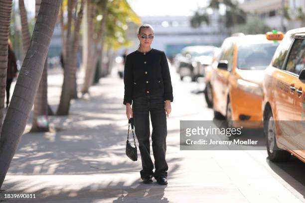 Rebecca Katherine Levenson seen wearing gold sunglasses, gold earrings, Massimo Dutti black boucle knit cardigan jacket, Chanel black leather bag,...