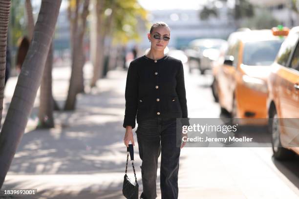 Rebecca Katherine Levenson seen wearing gold sunglasses, gold earrings, Massimo Dutti black boucle knit cardigan jacket, Chanel black leather bag,...