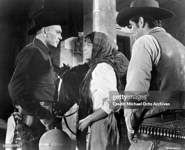 Actor Yul Brynner and actress Elisa Montes on set of the movie "Return of the Seven" in 1966.