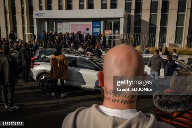 Taxi drivers gather outside the 'Caisse primaire d'assurance maladie' during a demonstration against health insurance project law of "patient...