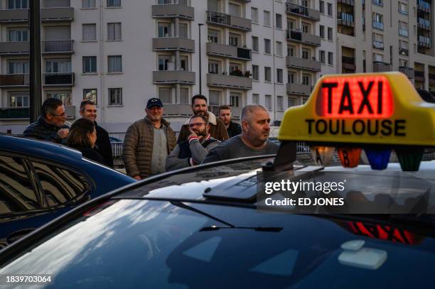Taxi drivers gather outside the 'Caisse primaire d'assurance maladie' during a demonstration against health insurance project law of "patient...