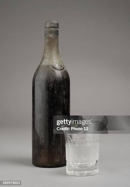 Cognac bottle from the house of Napoleon I in FontainebleauGlass goblet bearing the itinials of Napoleon ICrystal Former collection of Empress...