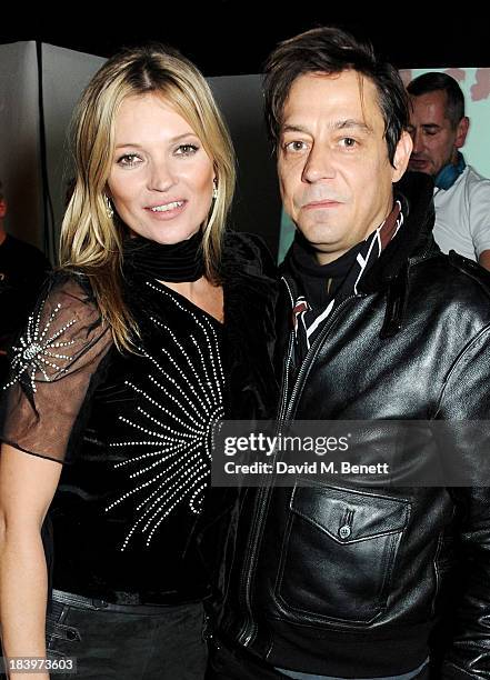 Kate Moss and Jamie Hince attend the Rimmel London 180 Years of Cool party at the London Film Museum on October 10, 2013 in London, England.