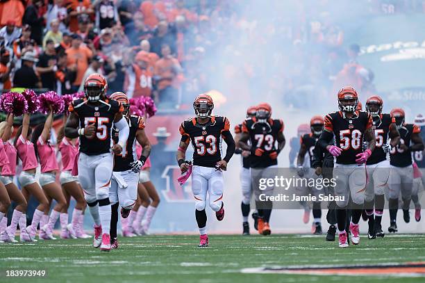 Michael Boley of the Cincinnati Bengals takes the field with Rey Maualuga and the rest of the team before a game against the New England Patriots at...