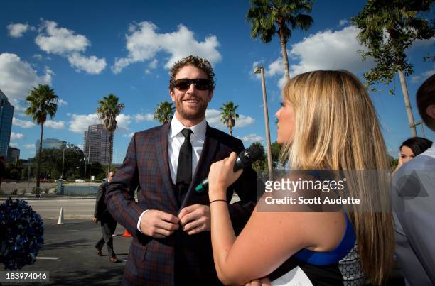Ryan Malone of the Tampa Bay Lightning arrives for the blue carpet walk before the game against the Florida Panthers at the Tampa Bay Times Forum on...