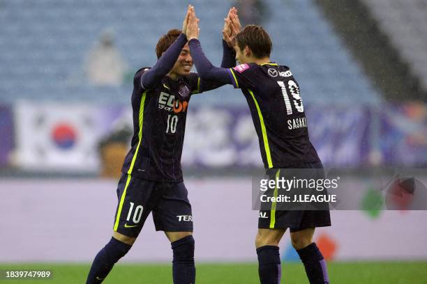 Takuma Asano of Sanfrecce Hiroshima celebrates with teammate Sho Sasaki after scoring the team's second goal during the Fuji Xerox Super Cup match...