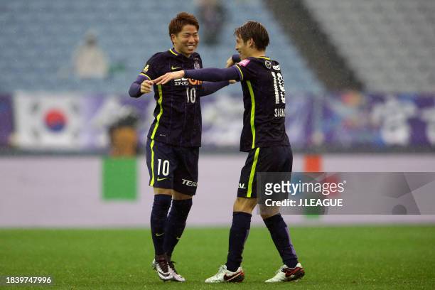 Takuma Asano of Sanfrecce Hiroshima celebrates with teammate Sho Sasaki after scoring the team's second goal during the Fuji Xerox Super Cup match...