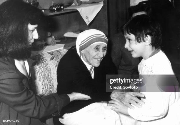 Mother Teresa Meets With Children From The 'Mother Teresa' Kindergarten In Tirana, Albania In 1990.