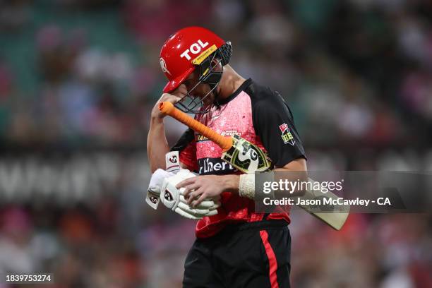 Joe Clarke of the Renegades walks off the field after run out by Jackson Bird of the Sixers during the BBL match between Sydney Sixers and Melbourne...