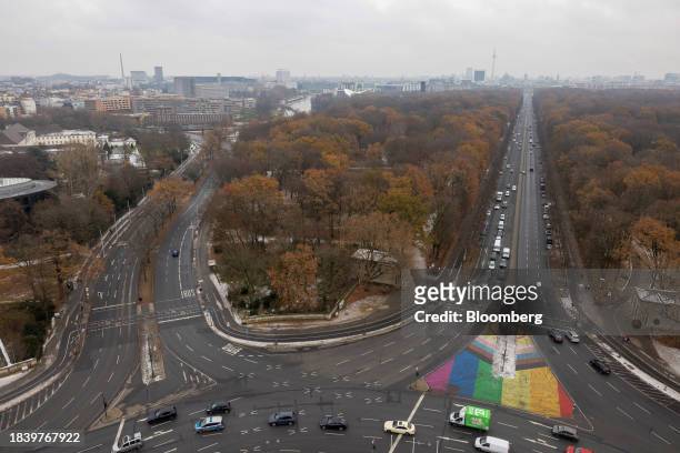 Vehicles travel along a federal highway through the Tiergarten, beyond the city skyline in Berlin, Germany, on Friday, Dec. 8, 2023. Chancellor Olaf...