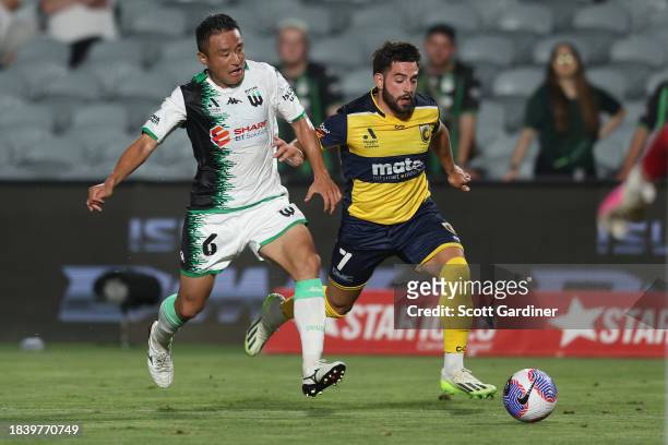 Tomoki Imai of Western United competes for the ball with Christian Theoharous of the Mariners during the A-League Men round seven match between...
