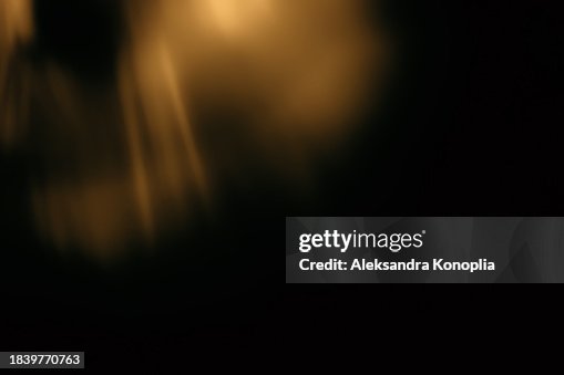 Golden crystal rainbow light leak texture effect on black background Golden crystal rainbow light leak texture effect on black background