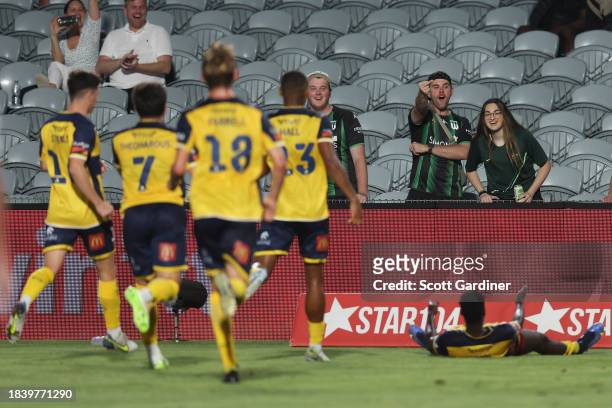 Western United fans gestures to Alou Kuol of the Mariners followinghis goal during the A-League Men round seven match between Central Coast Mariners...