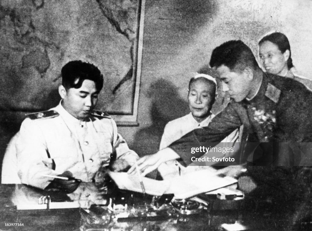 Kim Il Sung signing the Korean Armistice Agreement